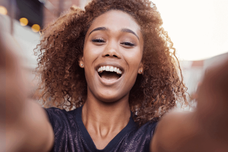 smiling woman taking a selfie