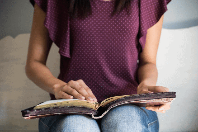 image of woman reading Bible verses about how to stop dieting