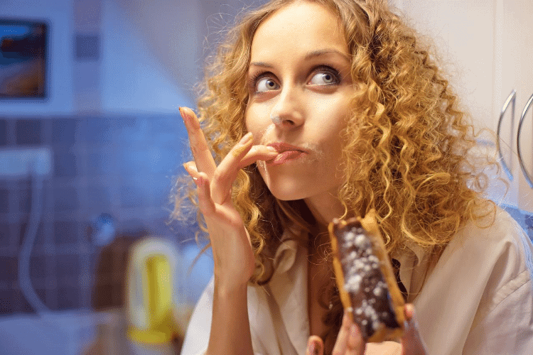 image of woman eating chocolate