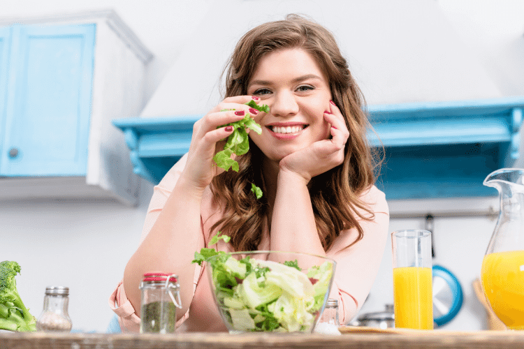 woman happily eating healthy food
