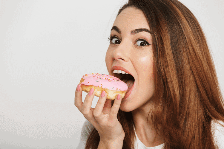 woman eating donut