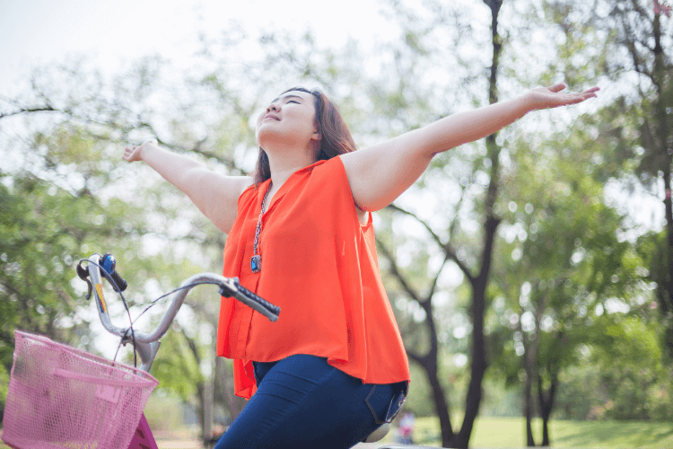 happy woman with freedom from emotional eating