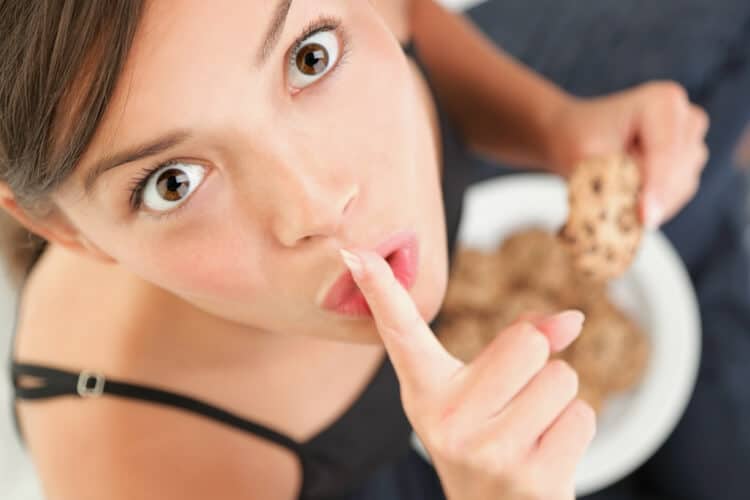 image of woman eating "bad" food
