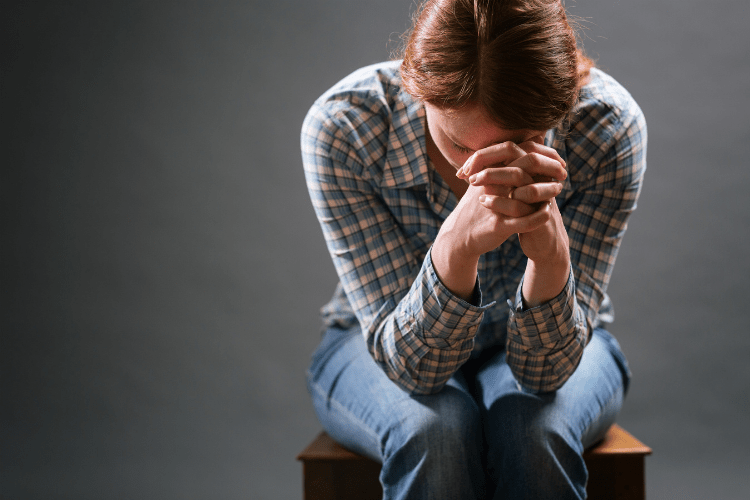 woman praying for weight loss