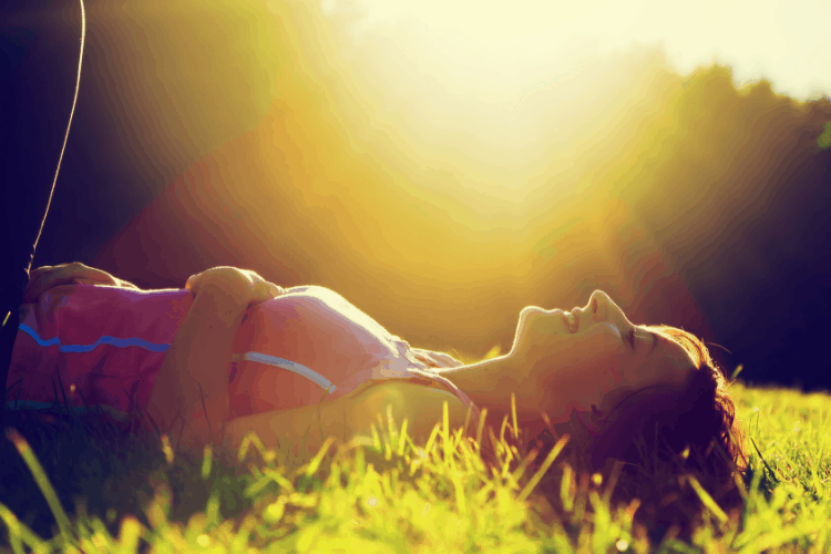 image of woman relaxing in the sun