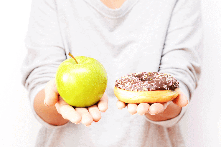 image of dieter holding donut and apple