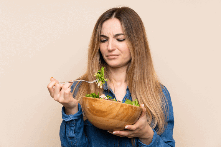 woman eating salad