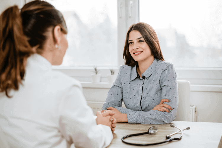 image of woman talking to doctor
