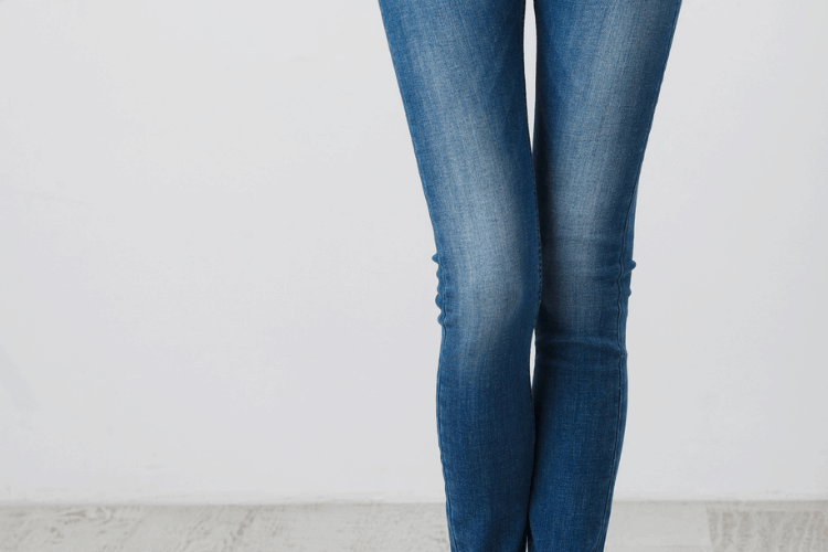 woman legs wearing jeans