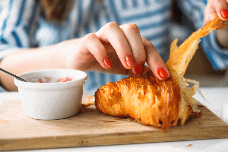 woman eating bread